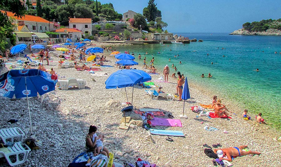People sunbathing at the Stikovica Beach near Dubrovnik