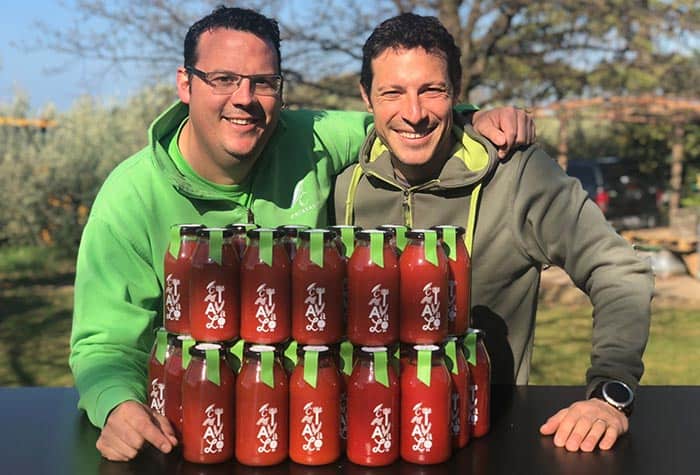 Photo of Chiavalon Olive Oil producers with their organic tomato sauce