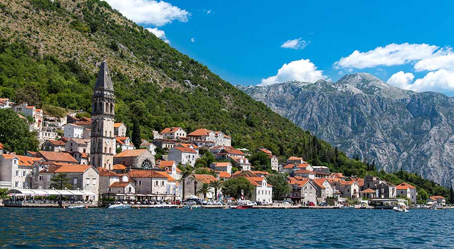 Houses, church and mountains in Perast, Kotor Bay, Montenegro, day trips from Dubrovnik