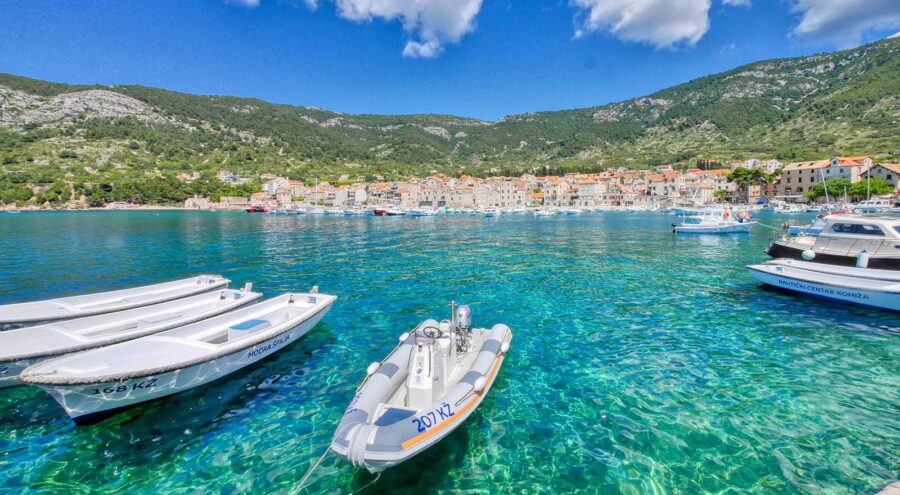 Small boats and the village of Komiza in the back, Vis Island, Croatia