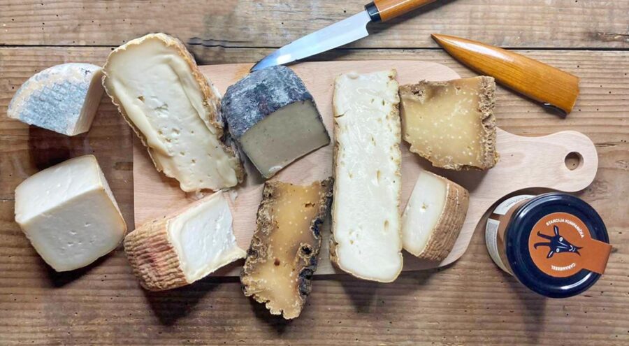 A wooden board with a range of Kumparicka goat cheeses